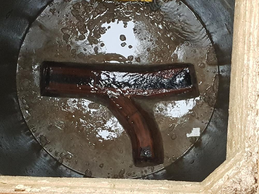 New inspection chamber base with channels fitted during a drain repair